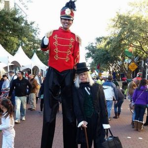 Scrooge Performer Holiday Entertainers and Christmas Stilt Walkers